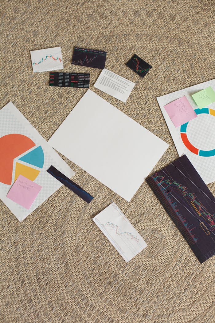 projects-header Overhead view of financial charts, graphs, and sticky notes on a carpet.